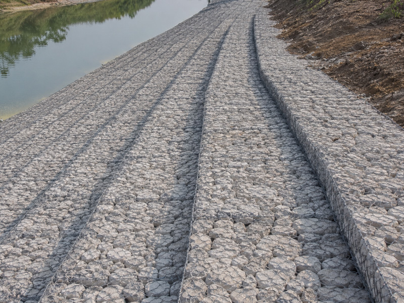 Gabion mats is a structure made of hexagonal double twisted wire mesh.